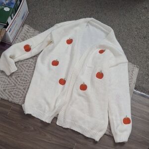 Cozy Cream Sweater with Pumpkin Accents